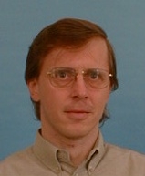 Portrétní fotografie dr. Petra Peňáze